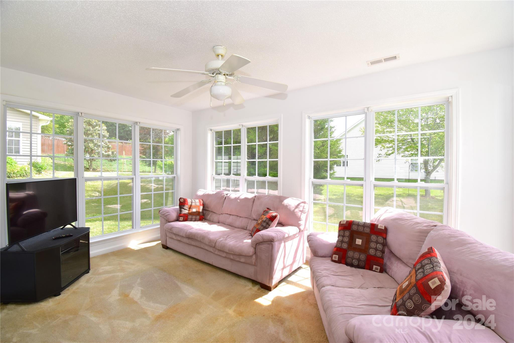 65 Cottage Ridge Road Fletcher, NC 28732 - Photo 9 of 40 a living room with furniture and a floor to ceiling window