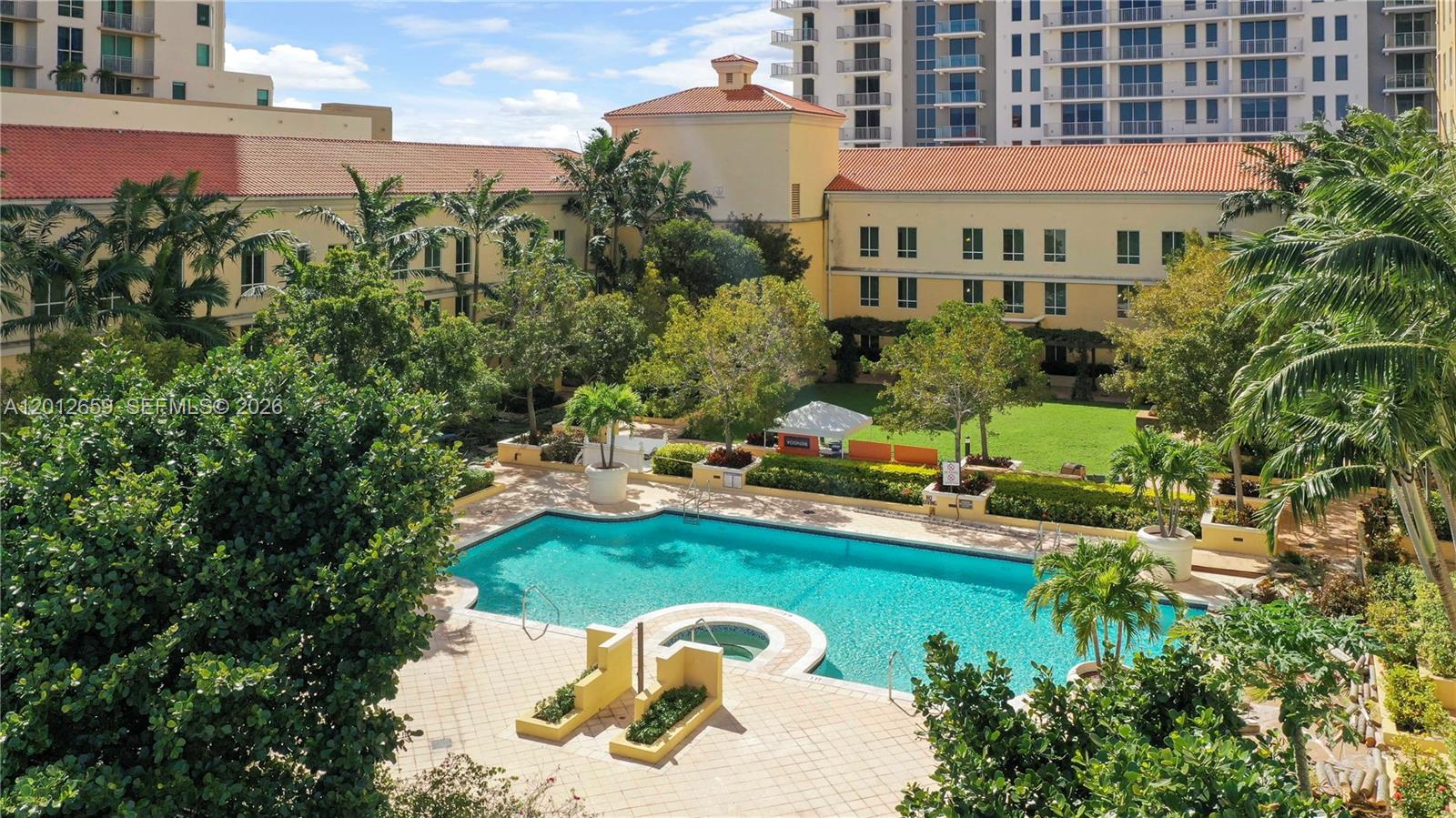 7355 Southwest 89th Street, Unit 501N Miami, FL 33156 - Photo 15 of 21 a view of a house with backyard outdoor seating area and swimming pool