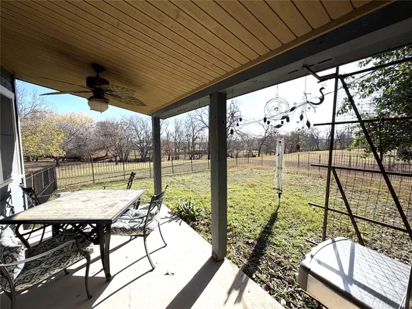 a view of an outdoor space with furniture