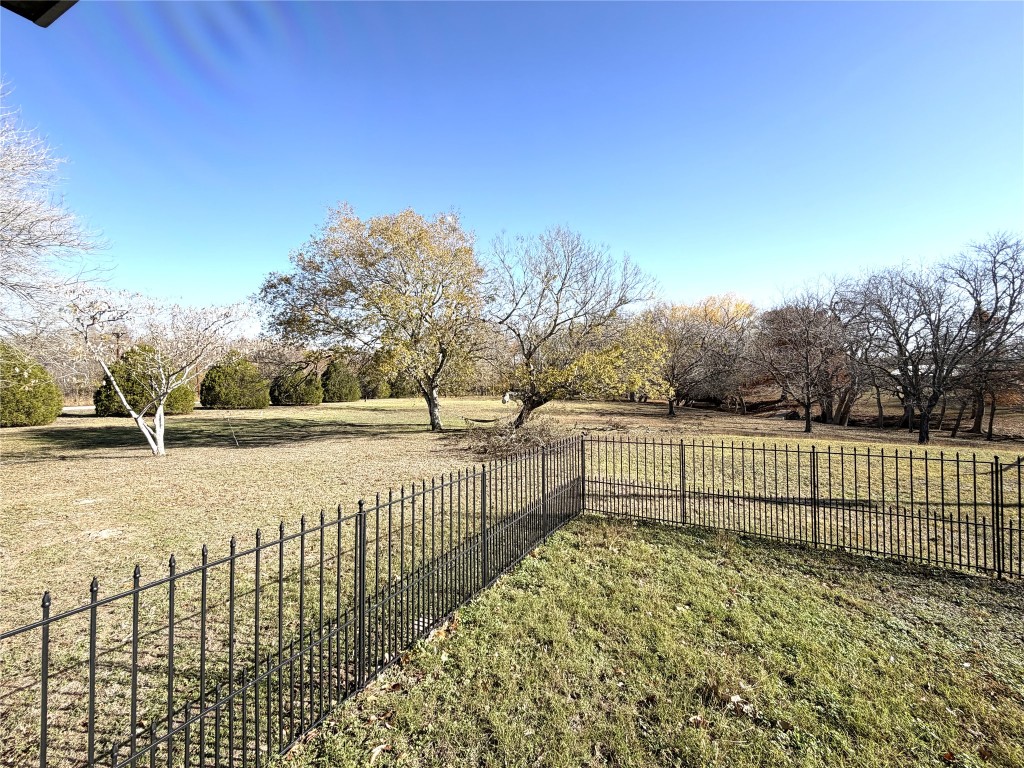 2035 Borchert Loop Lockhart, TX 78644 - Photo 18 of 25 a view of a yard with wooden fence
