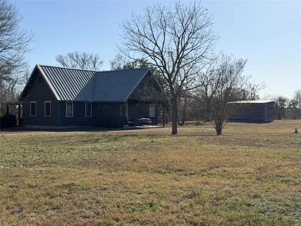 a house with trees in the background