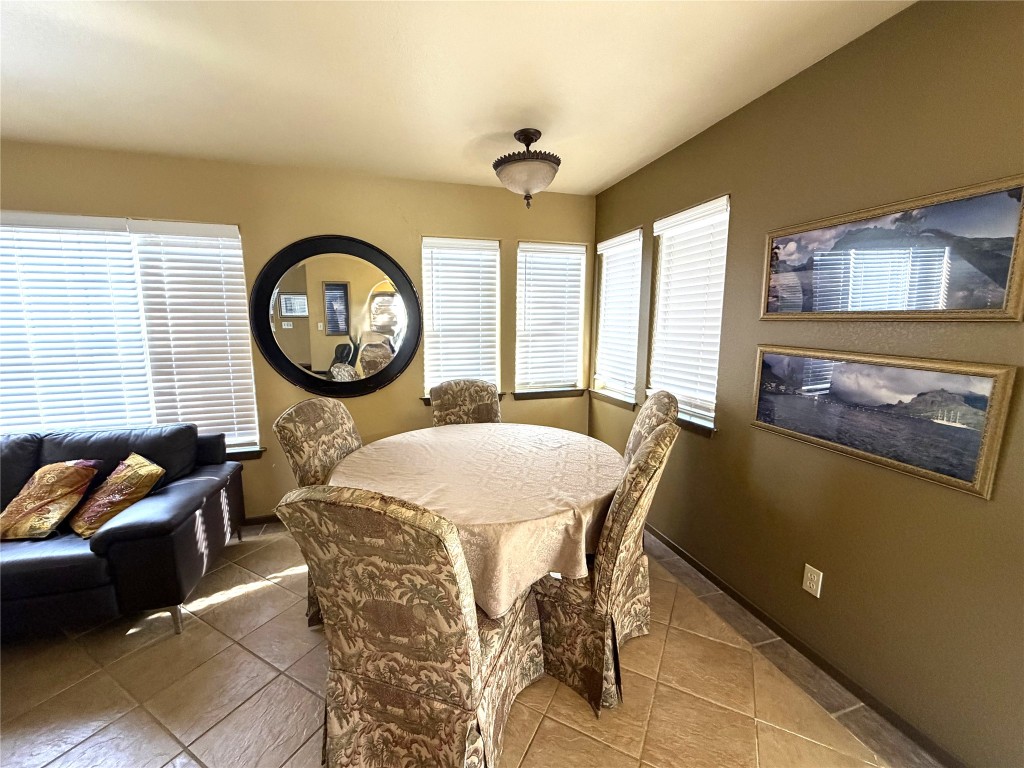 2035 Borchert Loop Lockhart, TX 78644 - Photo 5 of 25 a dining room with furniture and a large window