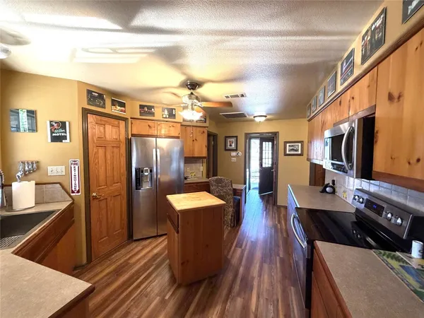 a outdoor space with lots of counter space and stainless steel appliances