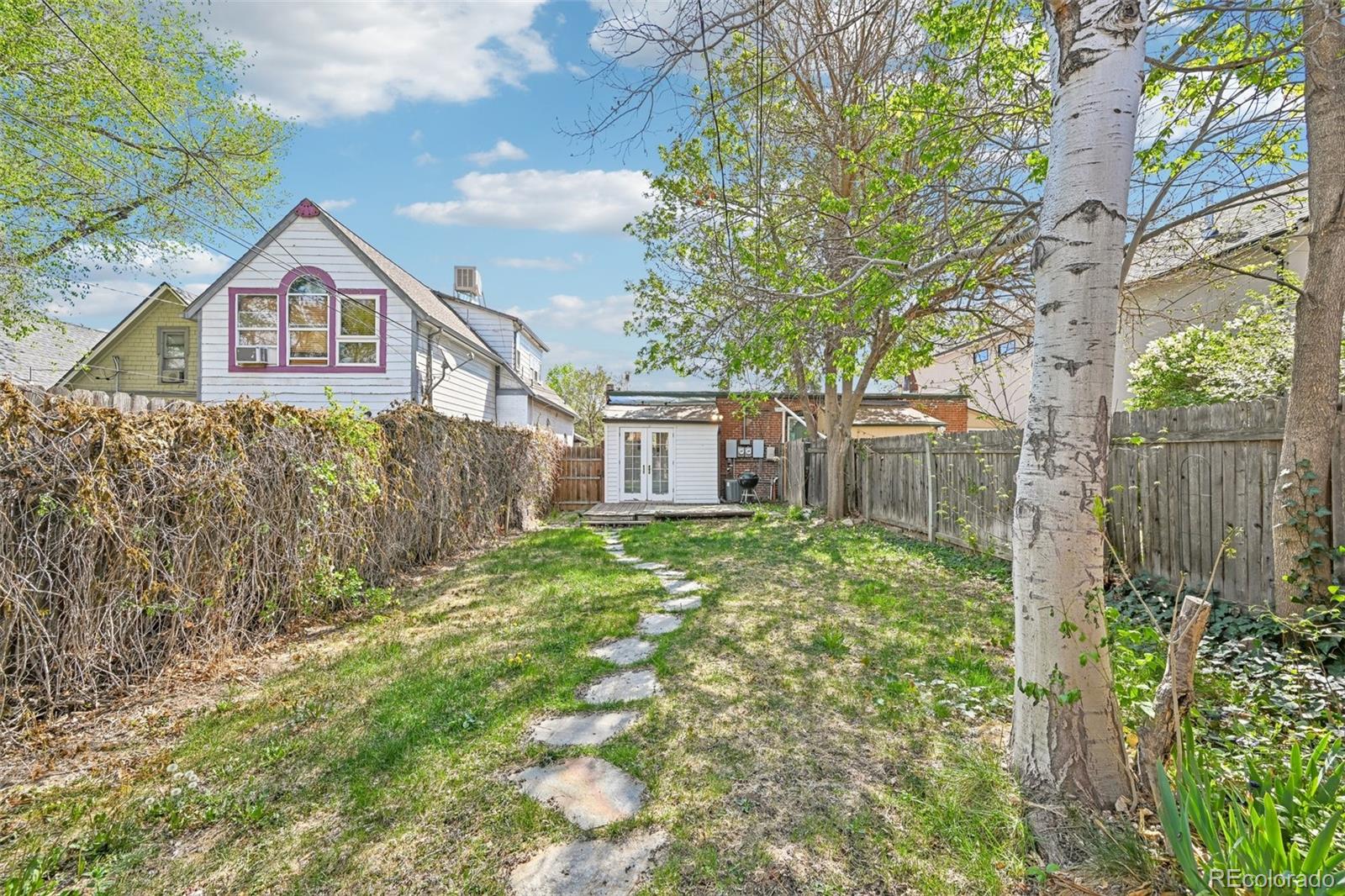 3275 Perry Street Denver, CO 80212 - Photo 23 of 38 a front view of a house with garden