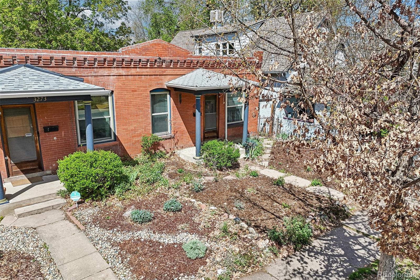 3275 Perry Street Denver, CO 80212 - Photo 31 of 38 a front view of a house with garden