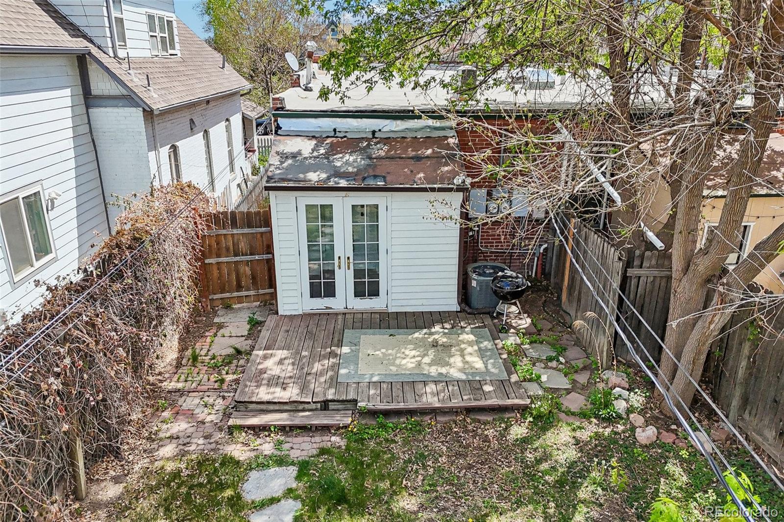 3275 Perry Street Denver, CO 80212 - Photo 33 of 38 a front view of a house with garden