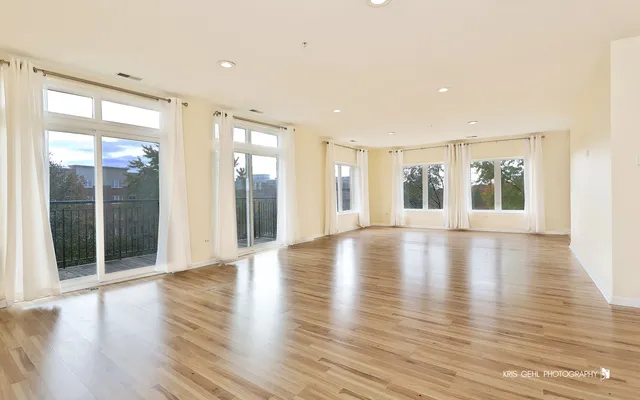 a view of a livingroom with wooden floor