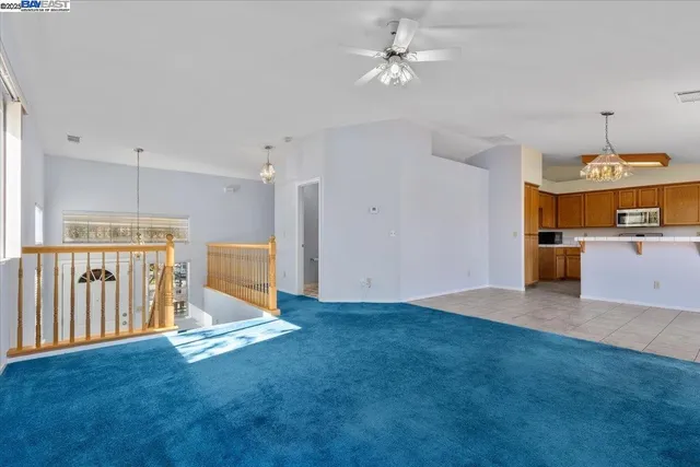 a view of kitchen with a sink cabinets and window