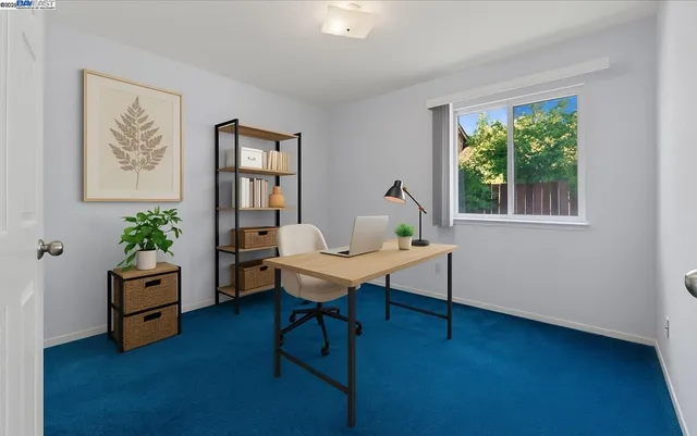 a workspace with furniture and a window