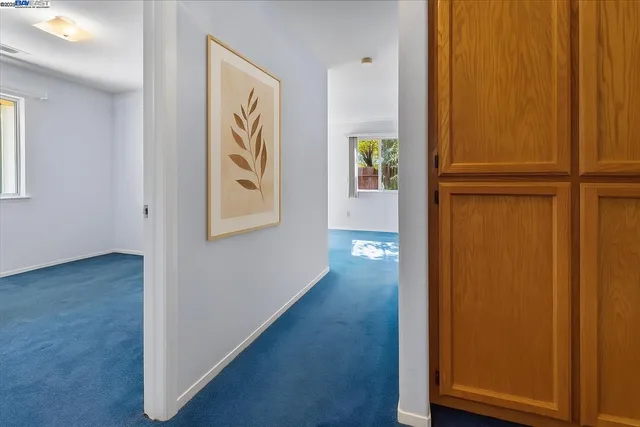 a view of front door with wooden floor