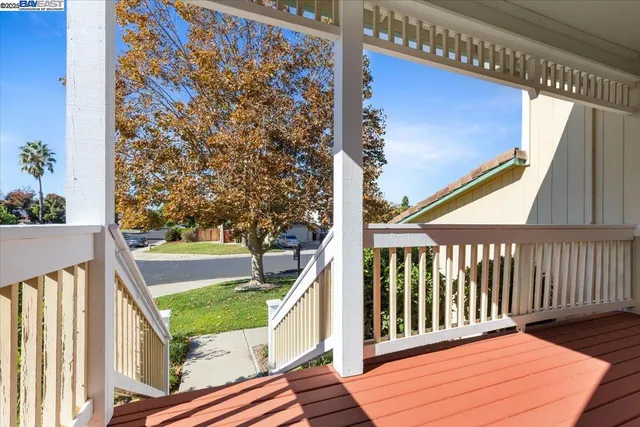 a view of balcony with wooden floor