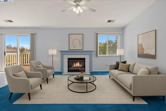 a living room with furniture and a fireplace