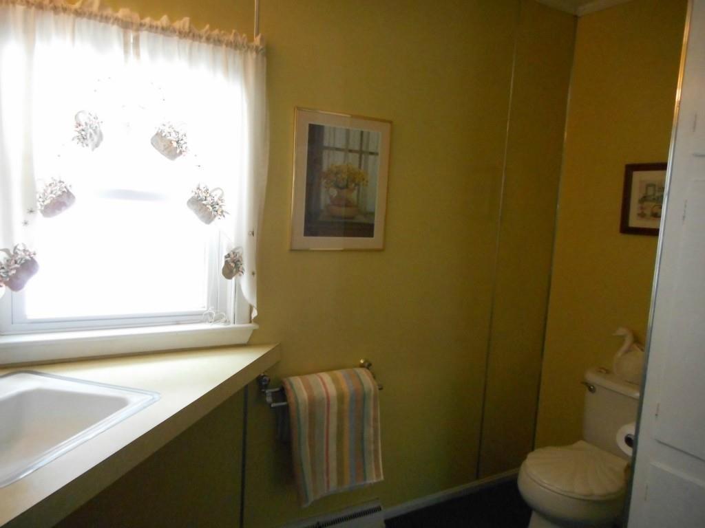579 Riverside Drive Auburn, ME 04210 - Photo 18 of 23 This full bath has wall panels that...