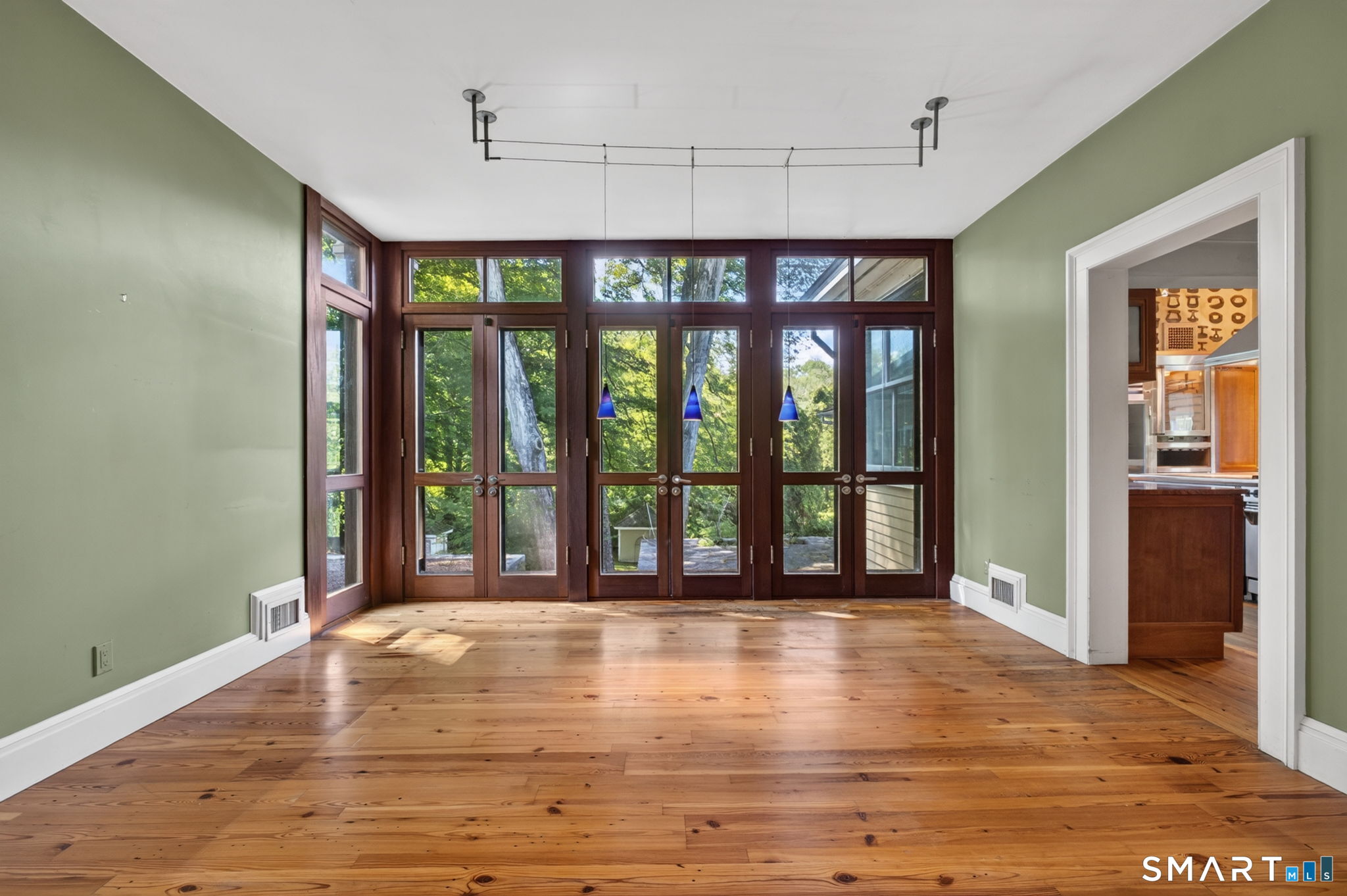 2 Rowland Road Old Lyme, CT 06371 - Photo 14 of 40 The dining room has gorgeous wood french doors that open to a granite patio.