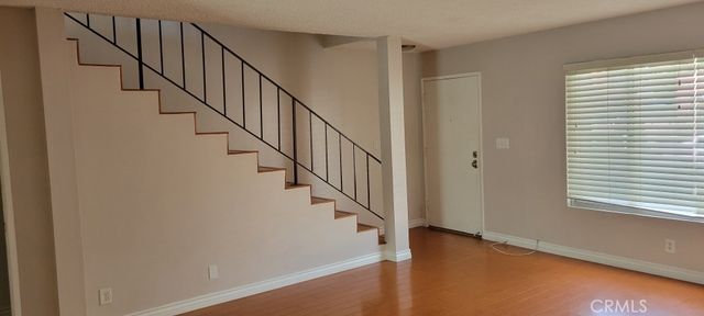 a view of entryway with wooden floor