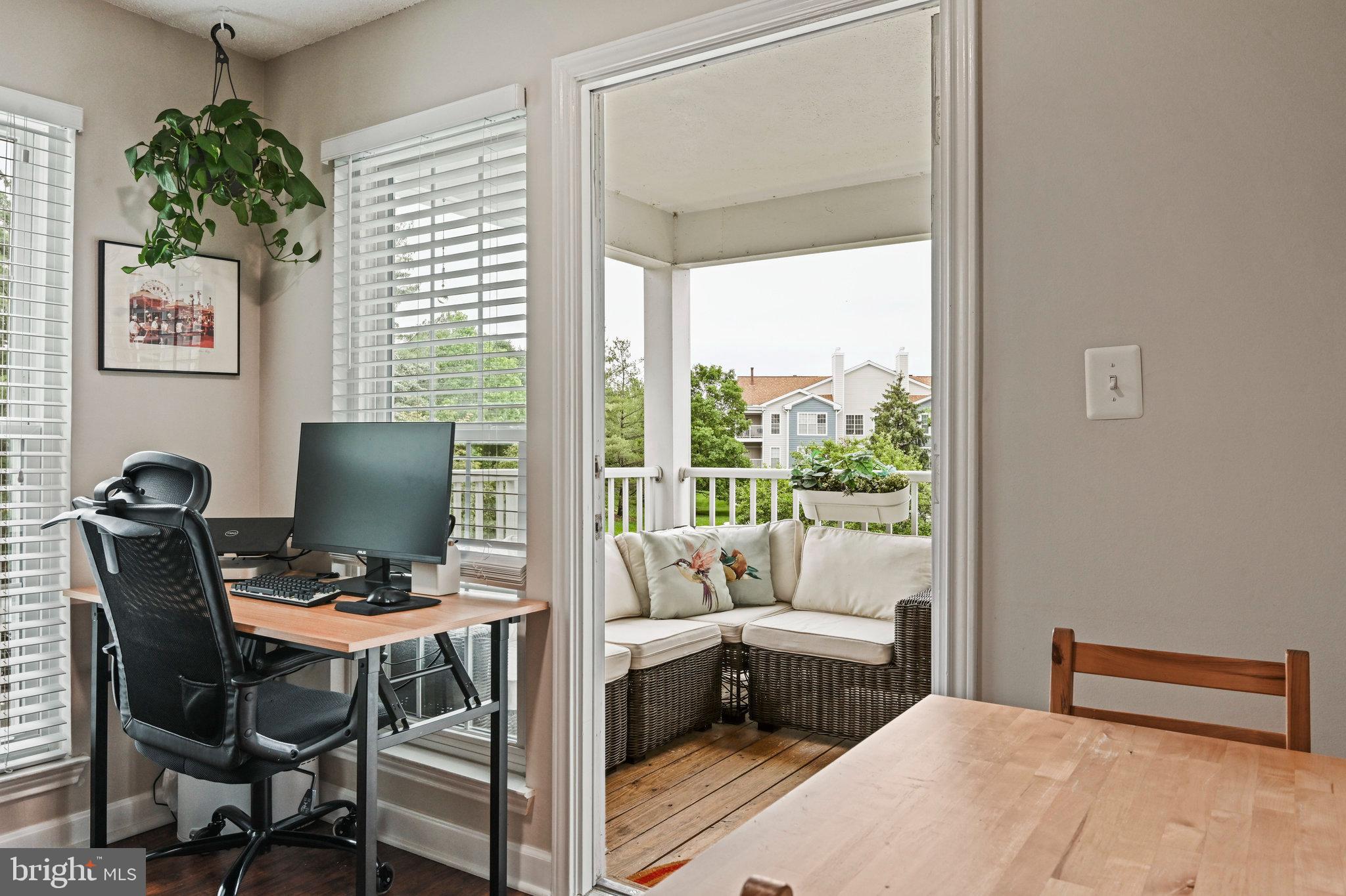 21013 Timber Ridge Terrace, Unit 202 Ashburn, VA 20147 - Photo 13 of 42 a workspace with furniture and a window