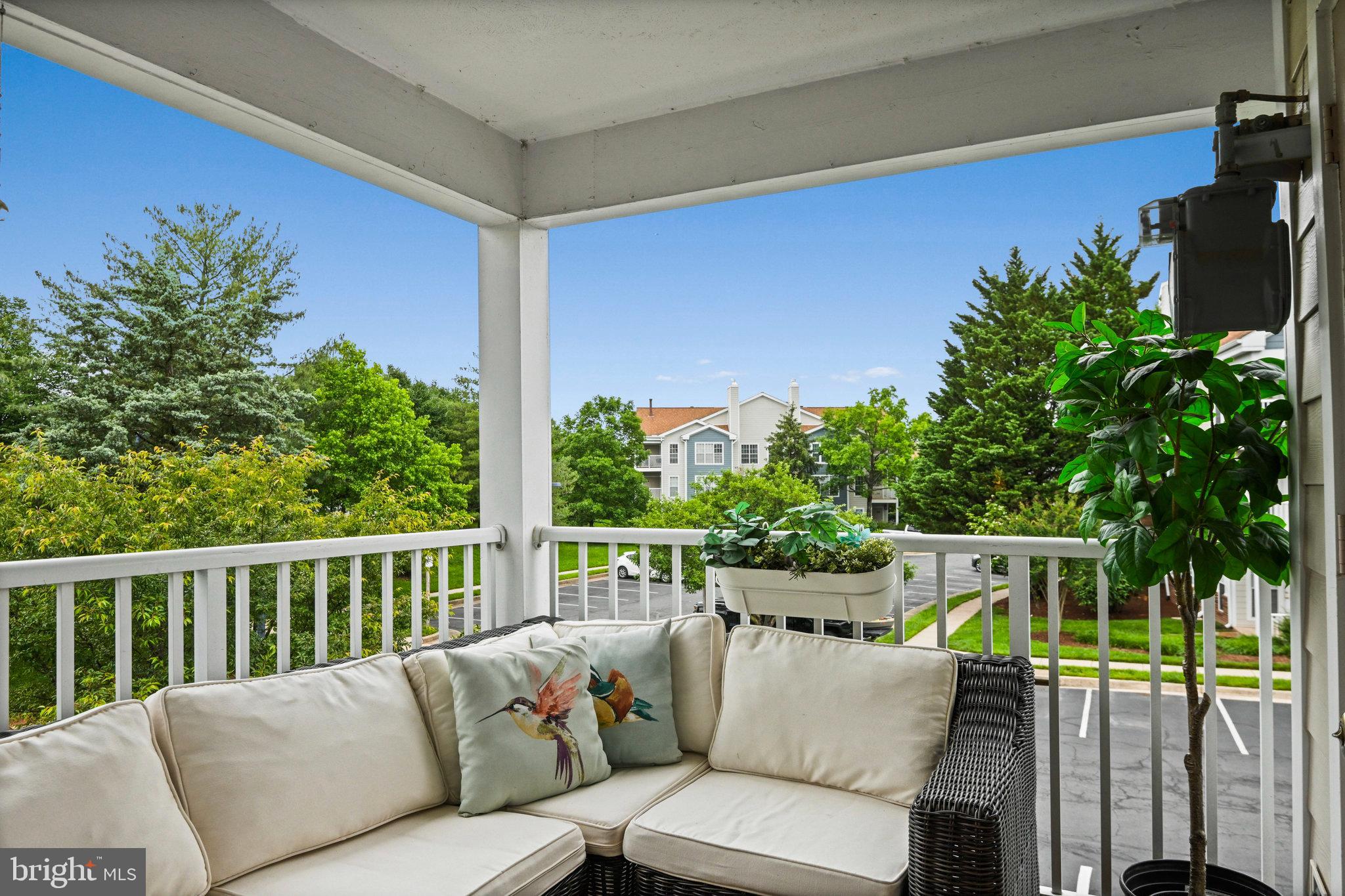 21013 Timber Ridge Terrace, Unit 202 Ashburn, VA 20147 - Photo 14 of 42 a balcony view with furniture
