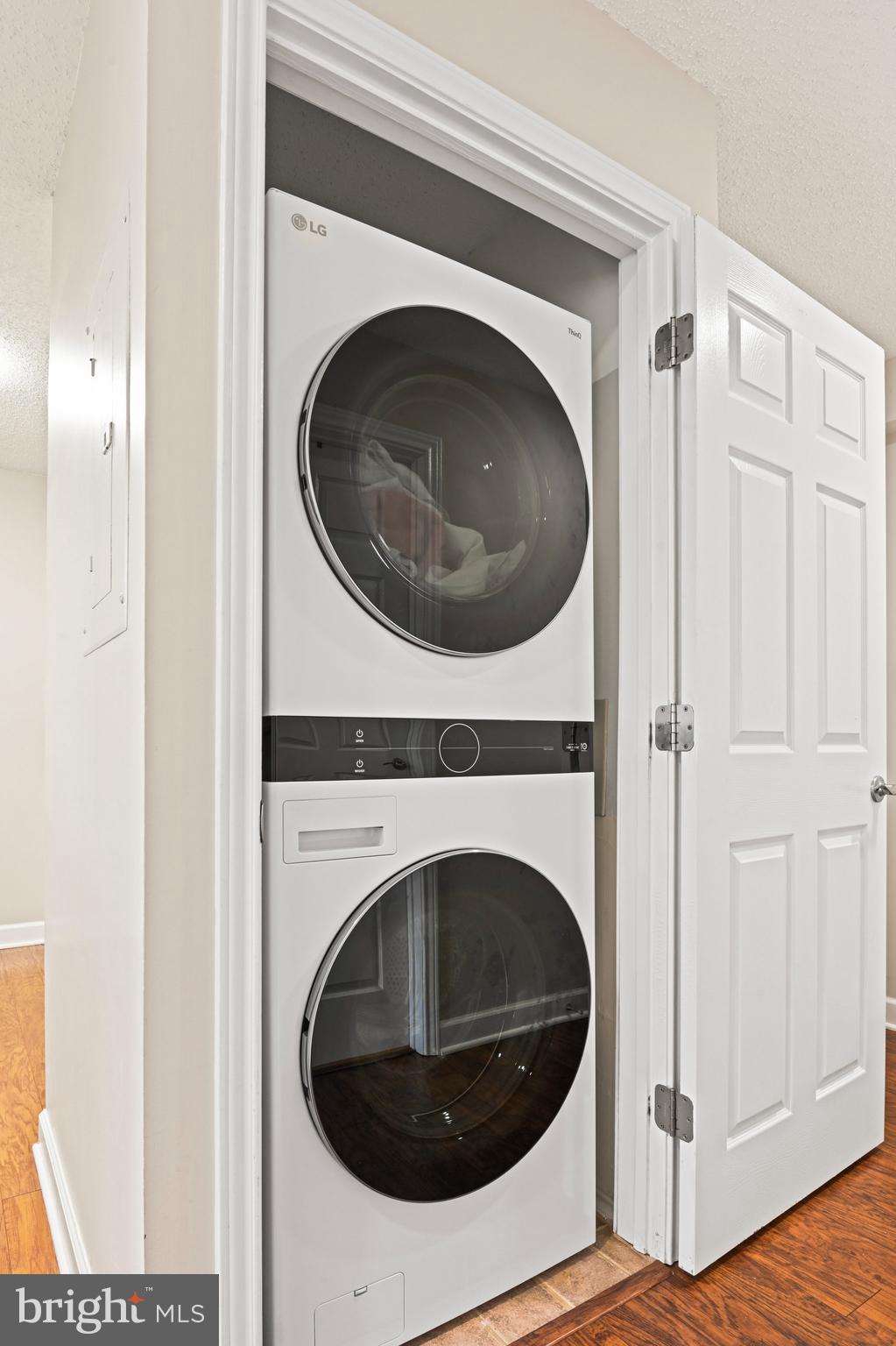 21013 Timber Ridge Terrace, Unit 202 Ashburn, VA 20147 - Photo 17 of 42 a view of a hallway with washer and dryer