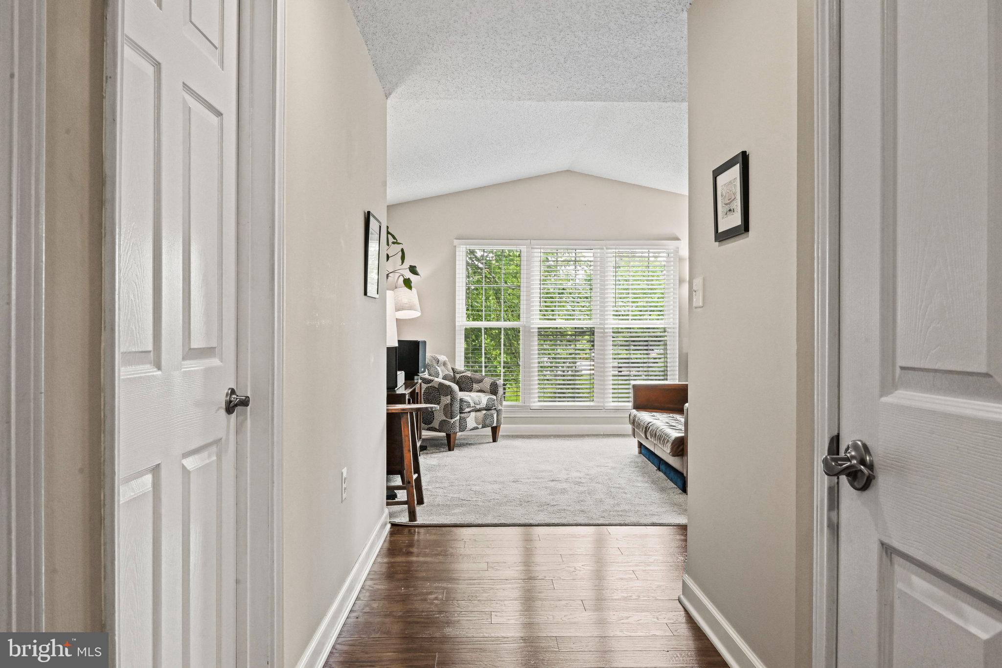 21013 Timber Ridge Terrace, Unit 202 Ashburn, VA 20147 - Photo 2 of 42 a very nice looking room with a large window