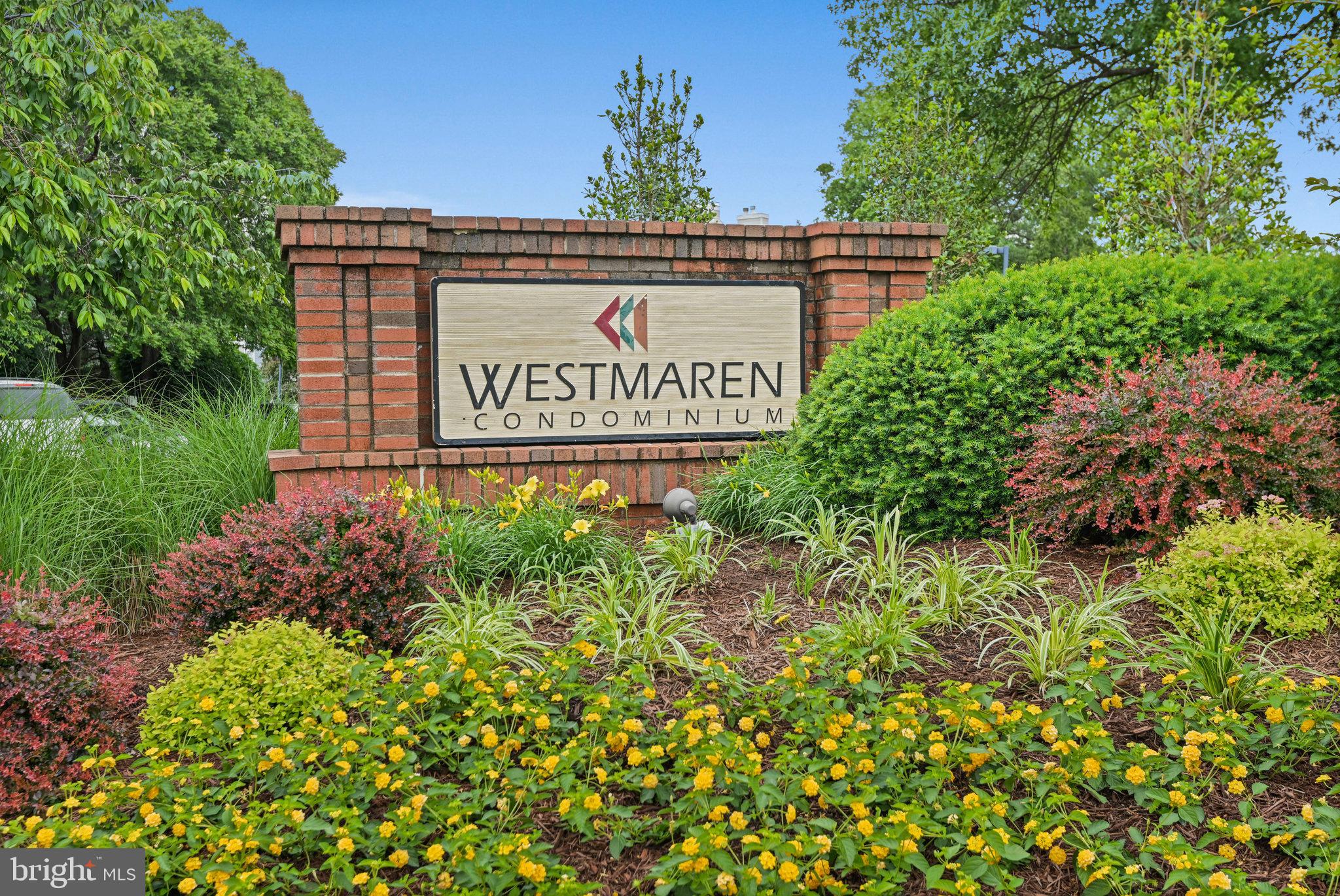 21013 Timber Ridge Terrace, Unit 202 Ashburn, VA 20147 - Photo 26 of 42 a sign on the side of a building
