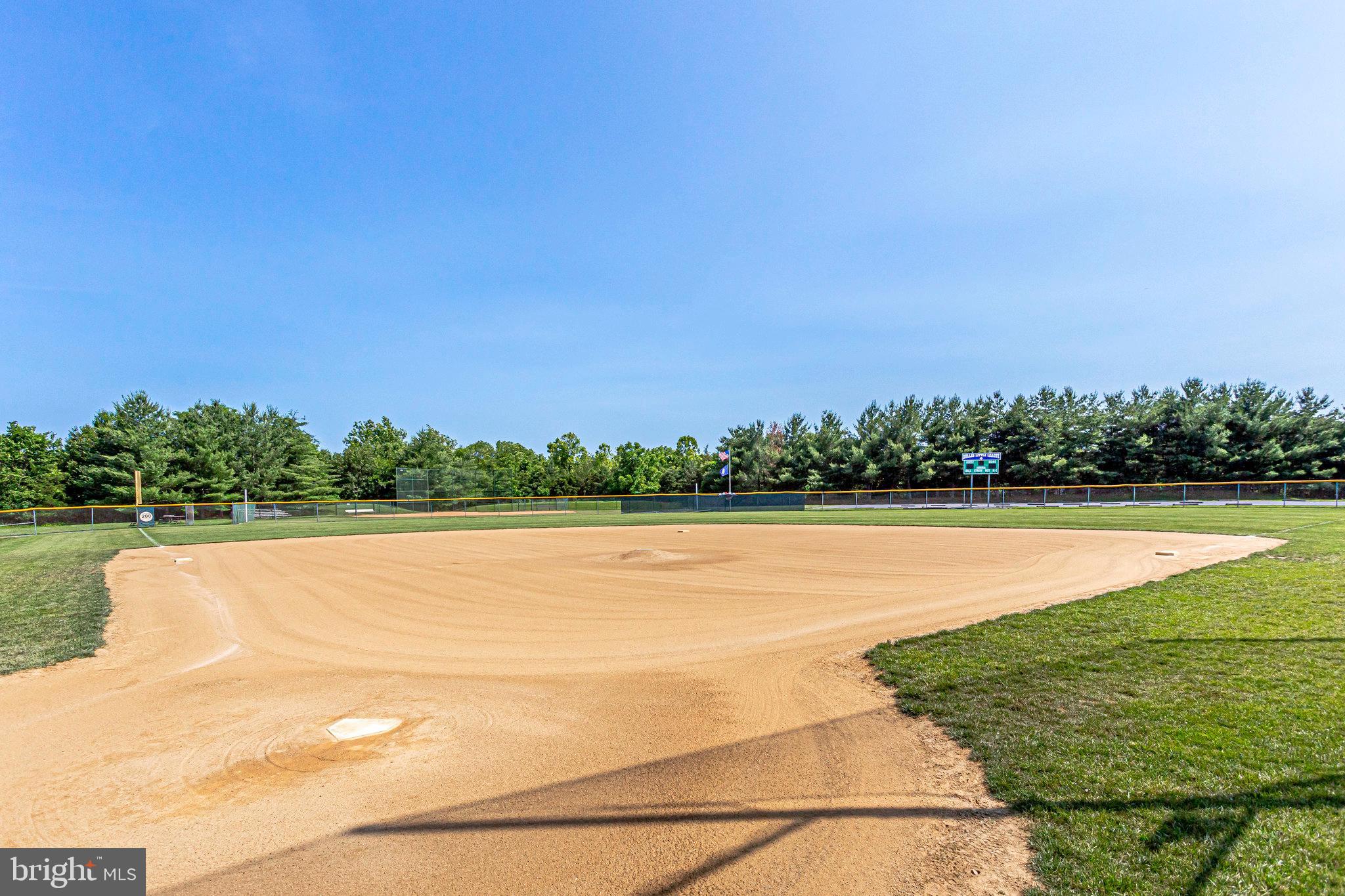 21013 Timber Ridge Terrace, Unit 202 Ashburn, VA 20147 - Photo 41 of 42 a view of a lake with houses in the background