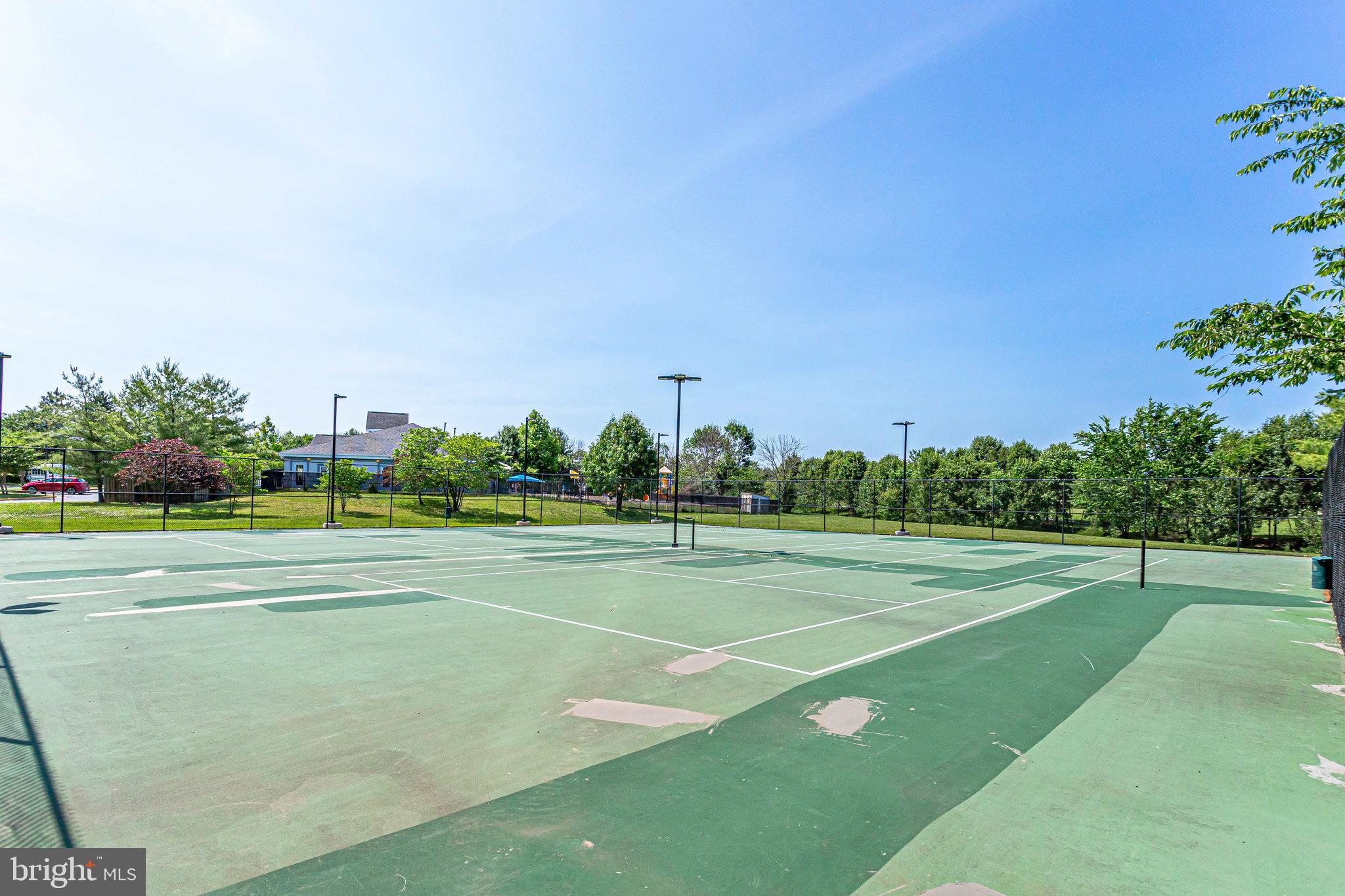 21013 Timber Ridge Terrace, Unit 202 Ashburn, VA 20147 - Photo 42 of 42 a view of an outdoor space and tennis court