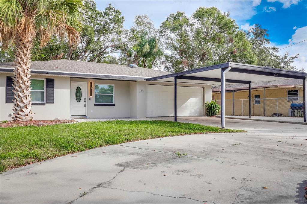 110 Duval Road Winter Haven, FL 33884 - Photo 1 of 25 a view of a barn house next to a yard with potted plants
