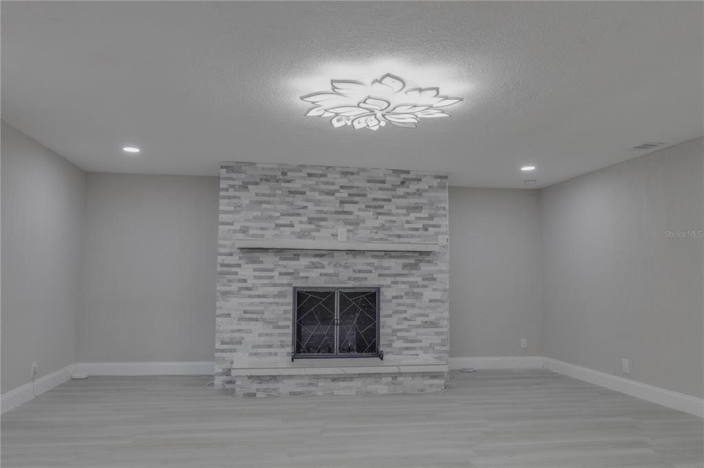 110 Duval Road Winter Haven, FL 33884 - Photo 14 of 25 a view of an empty room with a fireplace