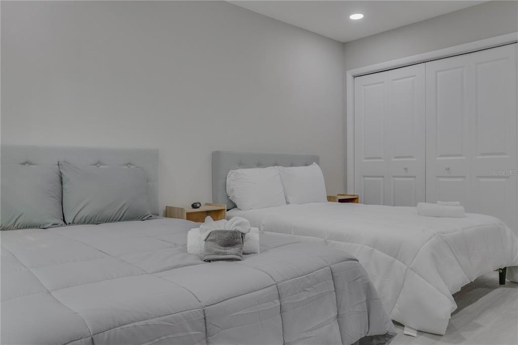 110 Duval Road Winter Haven, FL 33884 - Photo 6 of 25 a bedroom with a bed and cabinets