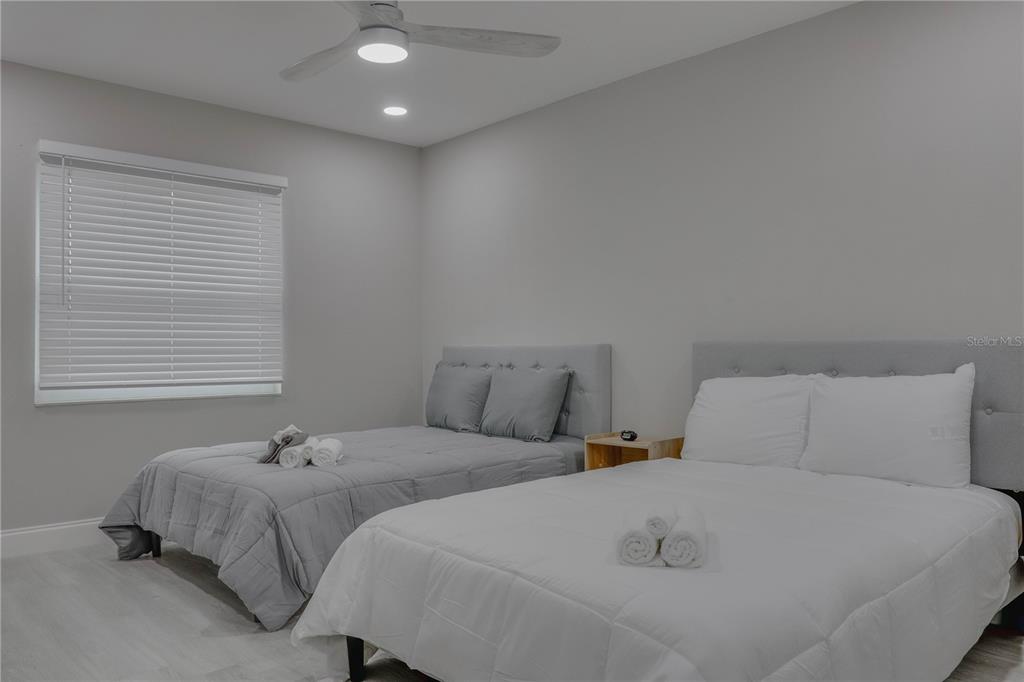 110 Duval Road Winter Haven, FL 33884 - Photo 7 of 25 a bedroom with two beds and next to a window