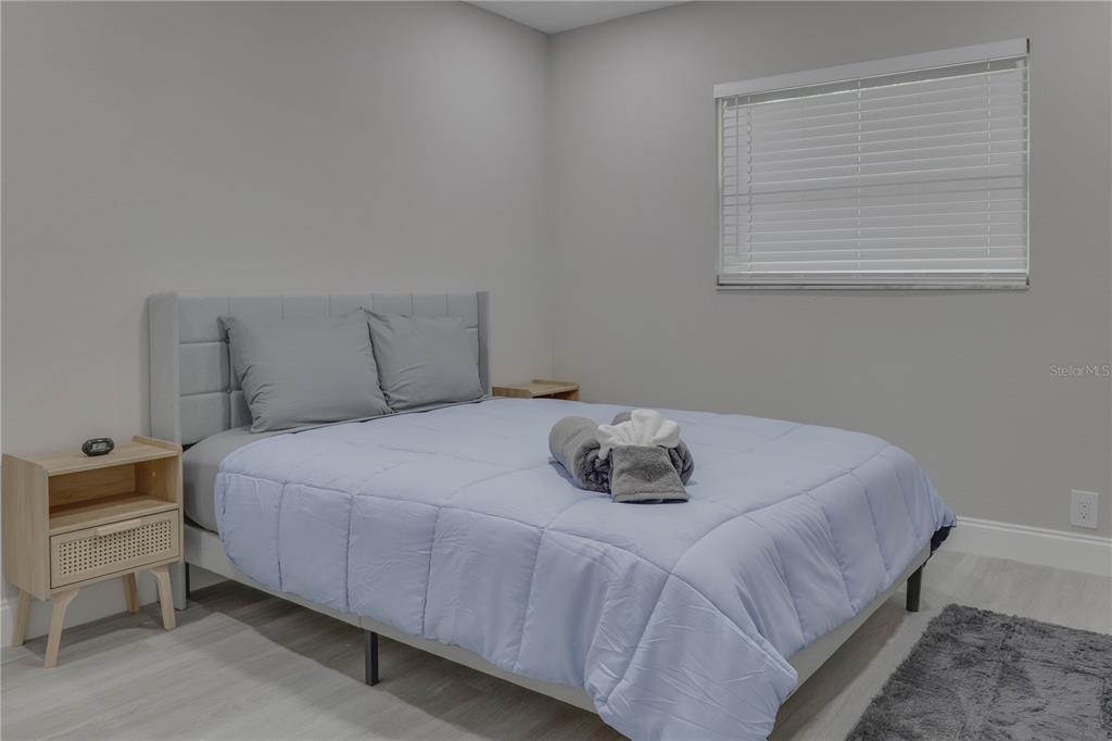 110 Duval Road Winter Haven, FL 33884 - Photo 8 of 25 a bedroom with a bed and window