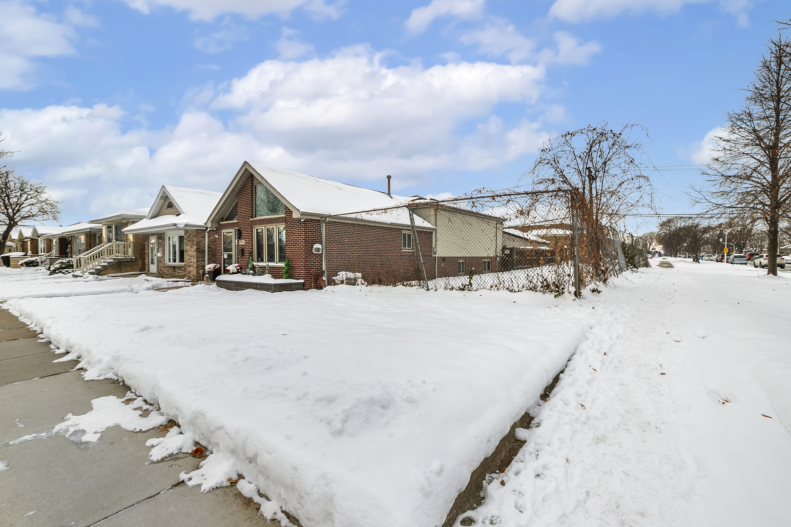 a view of a road with houses