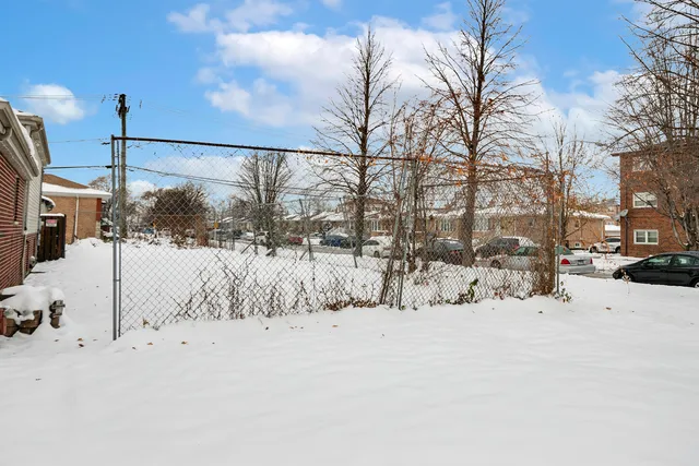 a view of snow on the roadside