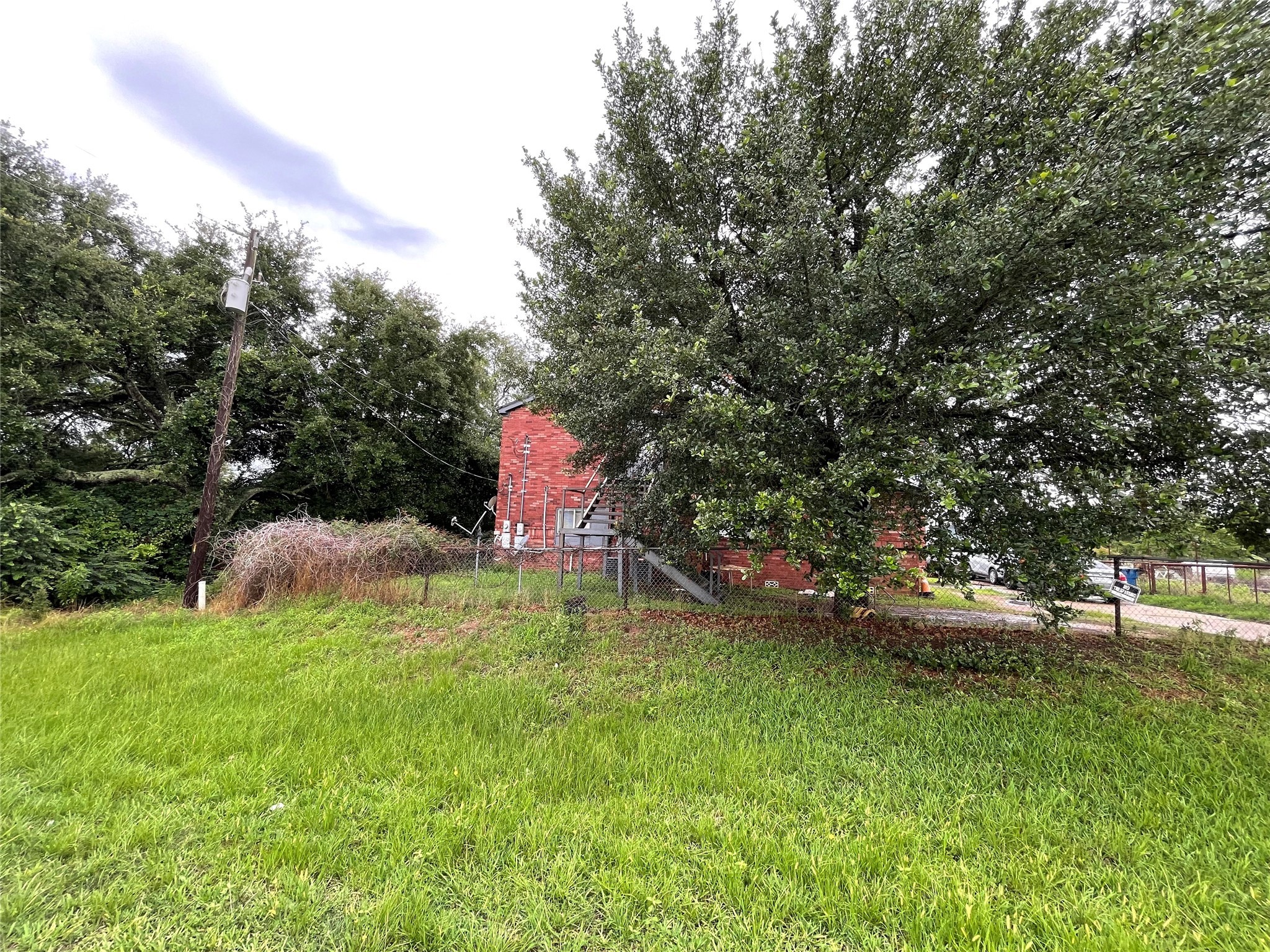 20661 Cochran Road Prairie View, TX 77445 - Photo 6 of 8 a backyard of a house with a yard and outdoor seating