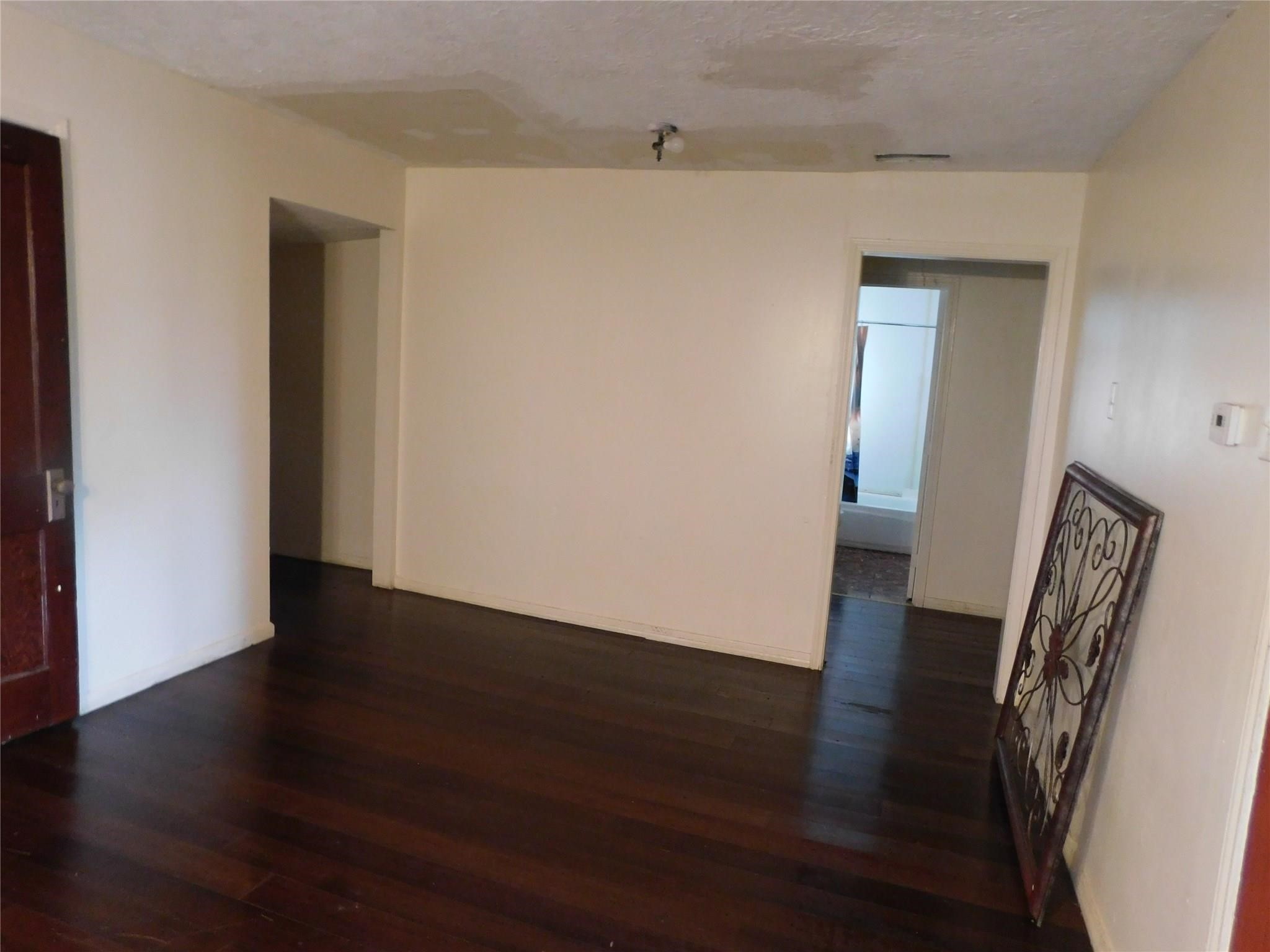 20661 Cochran Road Prairie View, TX 77445 - Photo 8 of 8 a view of a hallway with wooden floor
