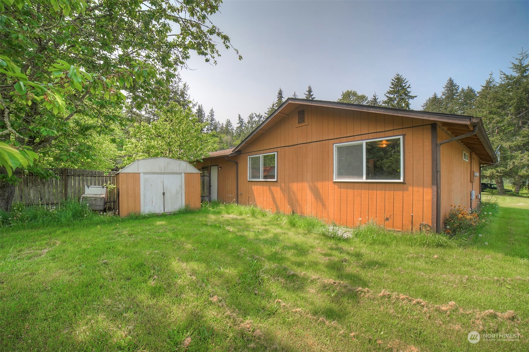 7615 Illahee Road Northeast Bremerton, WA 98311 - Photo 14 of 23 a view of a backyard with a garden