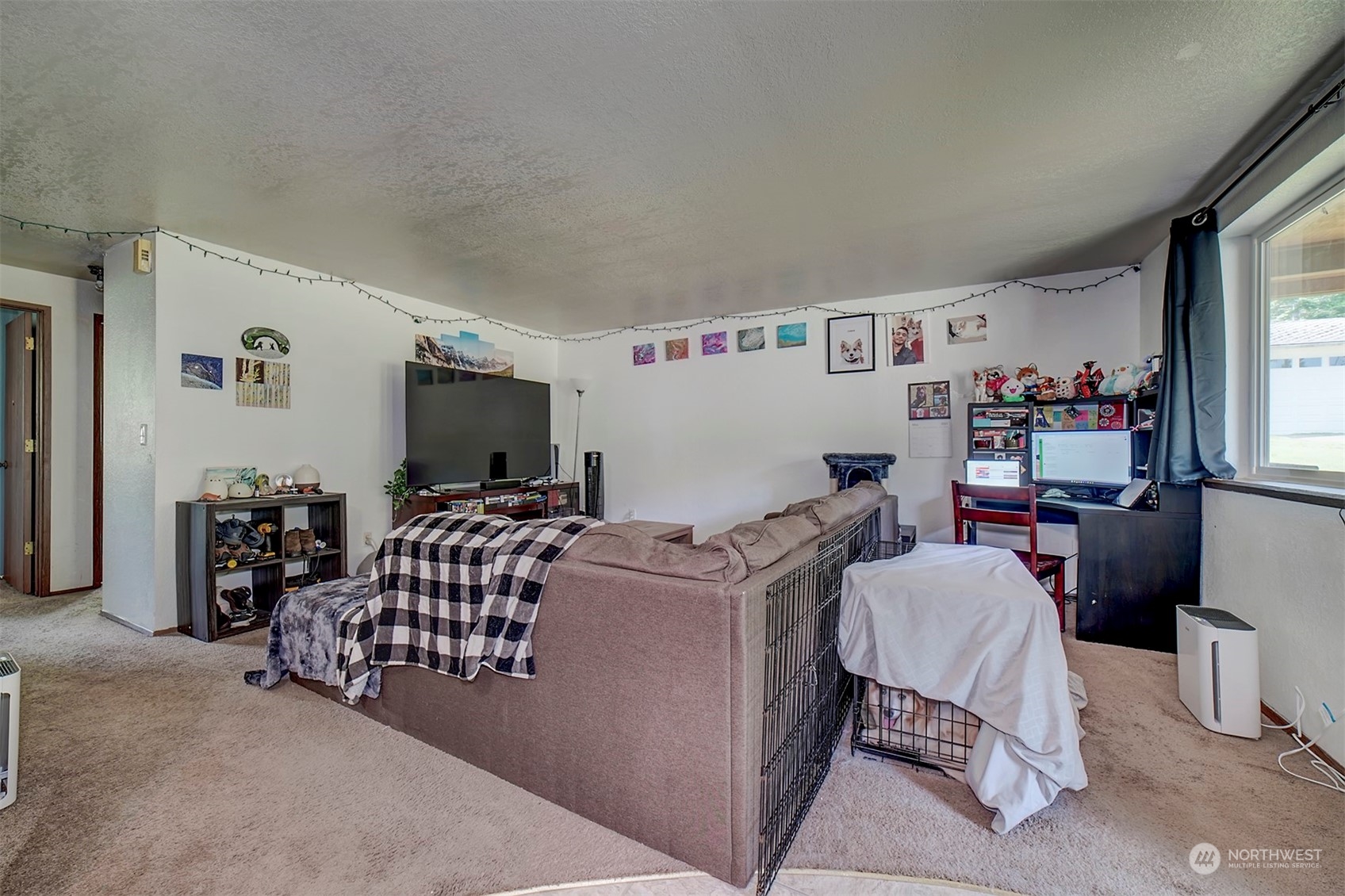 7615 Illahee Road Northeast Bremerton, WA 98311 - Photo 16 of 23 a living room with furniture and a flat screen tv