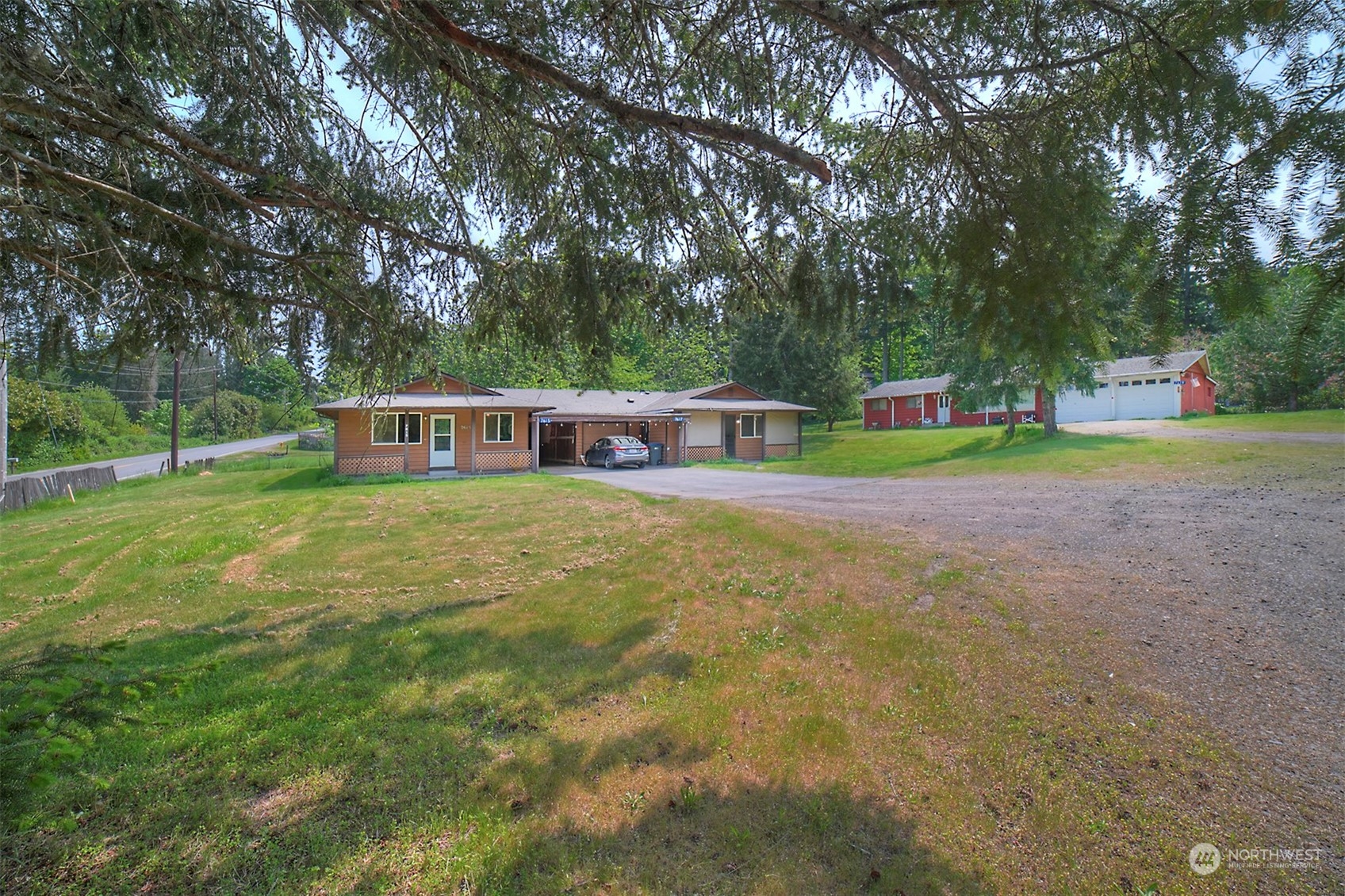 7615 Illahee Road Northeast Bremerton, WA 98311 - Photo 2 of 23 a view of a house with a yard and sitting area