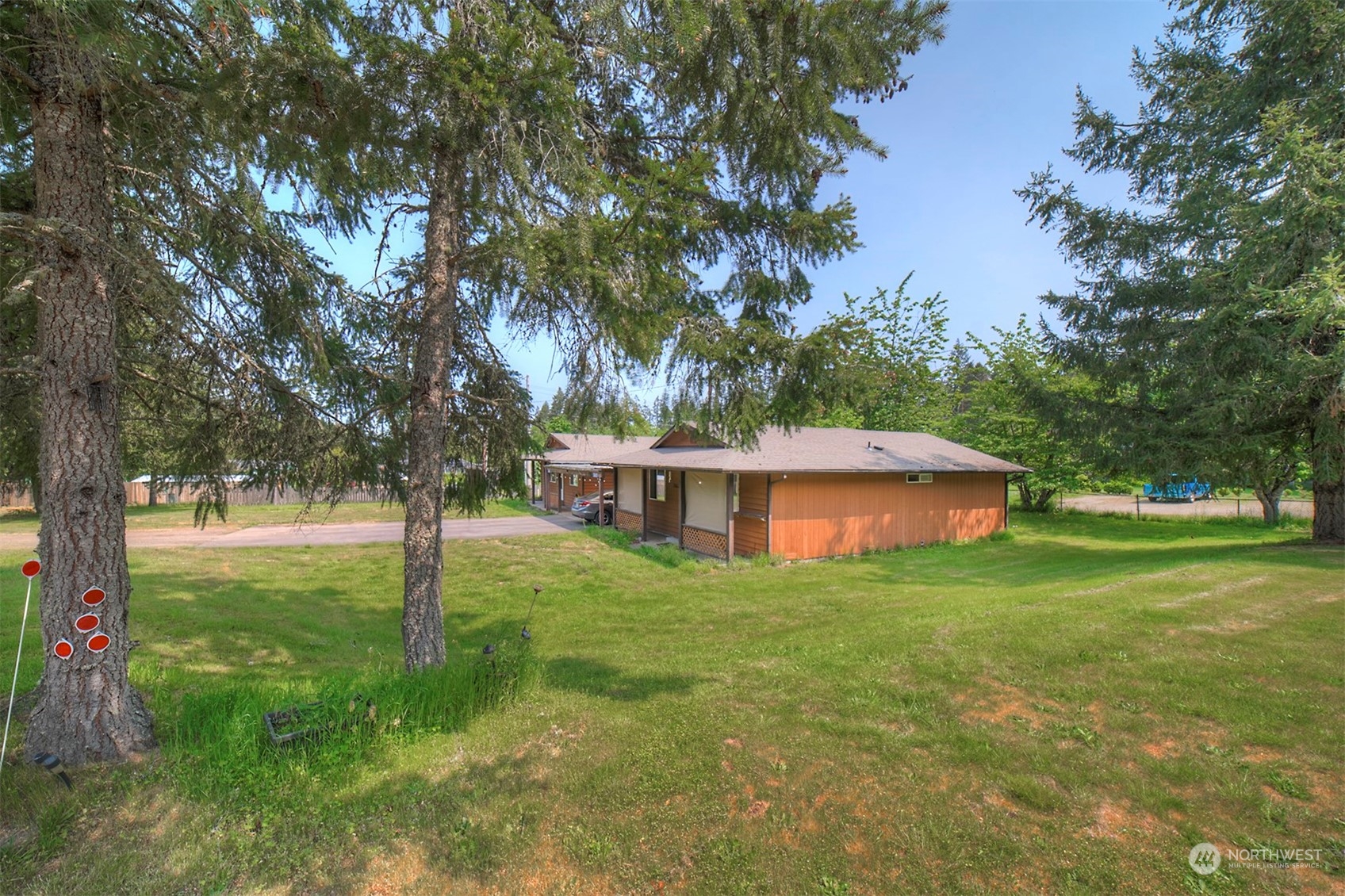 7615 Illahee Road Northeast Bremerton, WA 98311 - Photo 22 of 23 a view of house with backyard