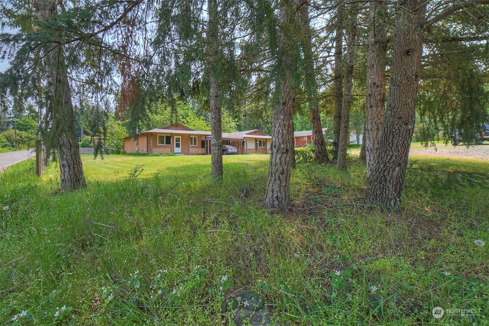7615 Illahee Road Northeast Bremerton, WA 98311 - Photo 23 of 23 a backyard of a house with lots of green space