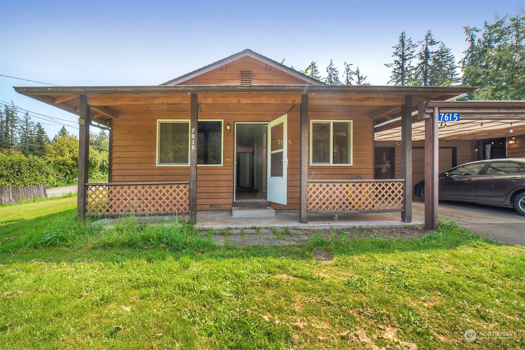 7615 Illahee Road Northeast Bremerton, WA 98311 - Photo 3 of 23 a front view of a house with a garden