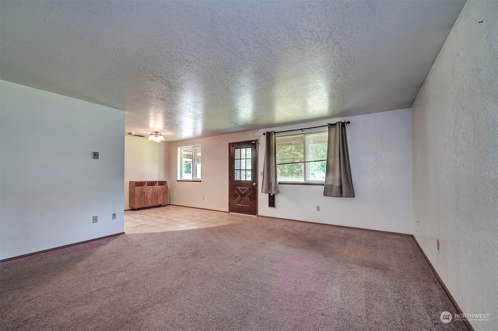 7615 Illahee Road Northeast Bremerton, WA 98311 - Photo 5 of 23 an empty room with windows