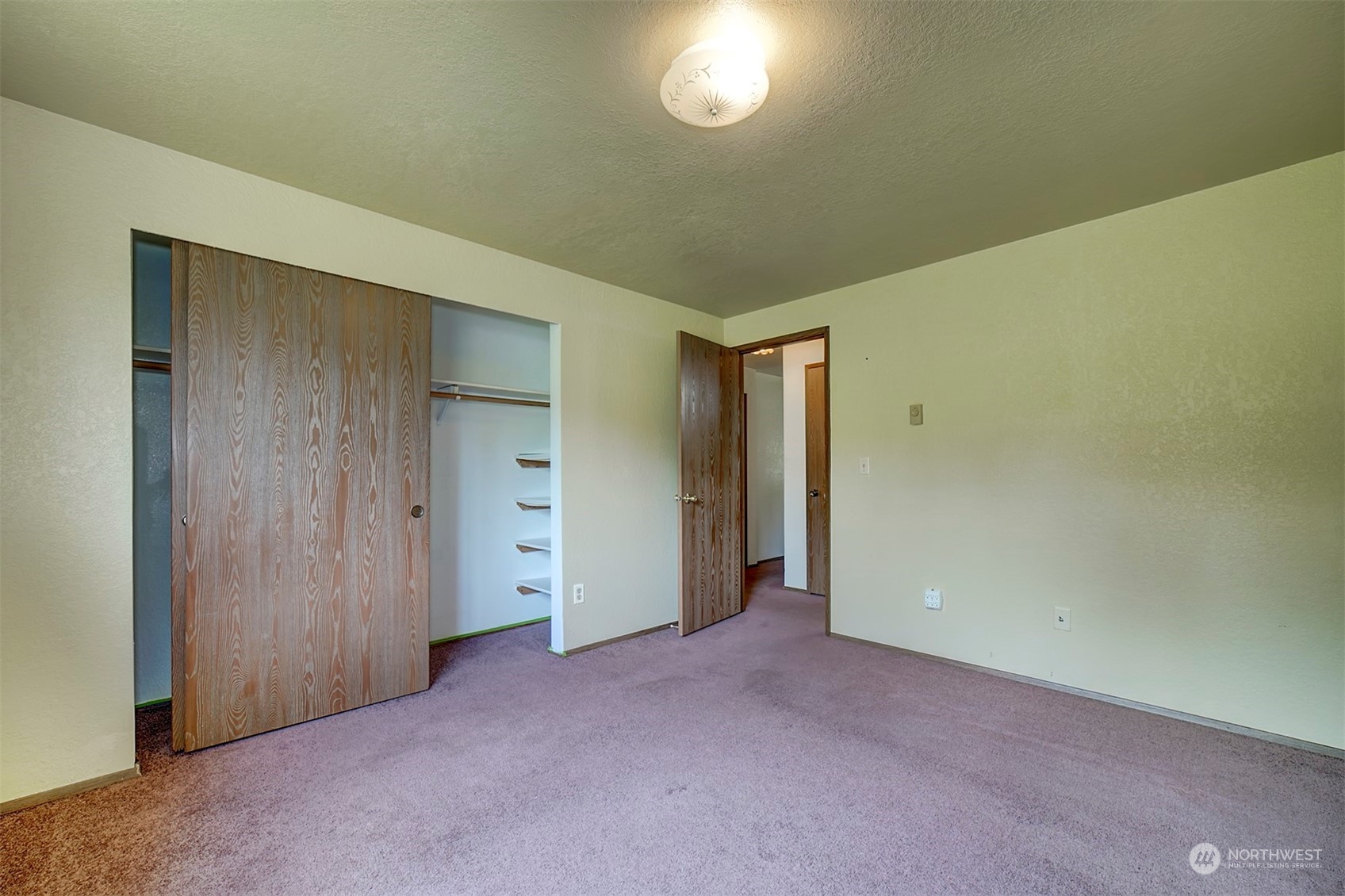 7615 Illahee Road Northeast Bremerton, WA 98311 - Photo 9 of 23 a view of an empty room and a window