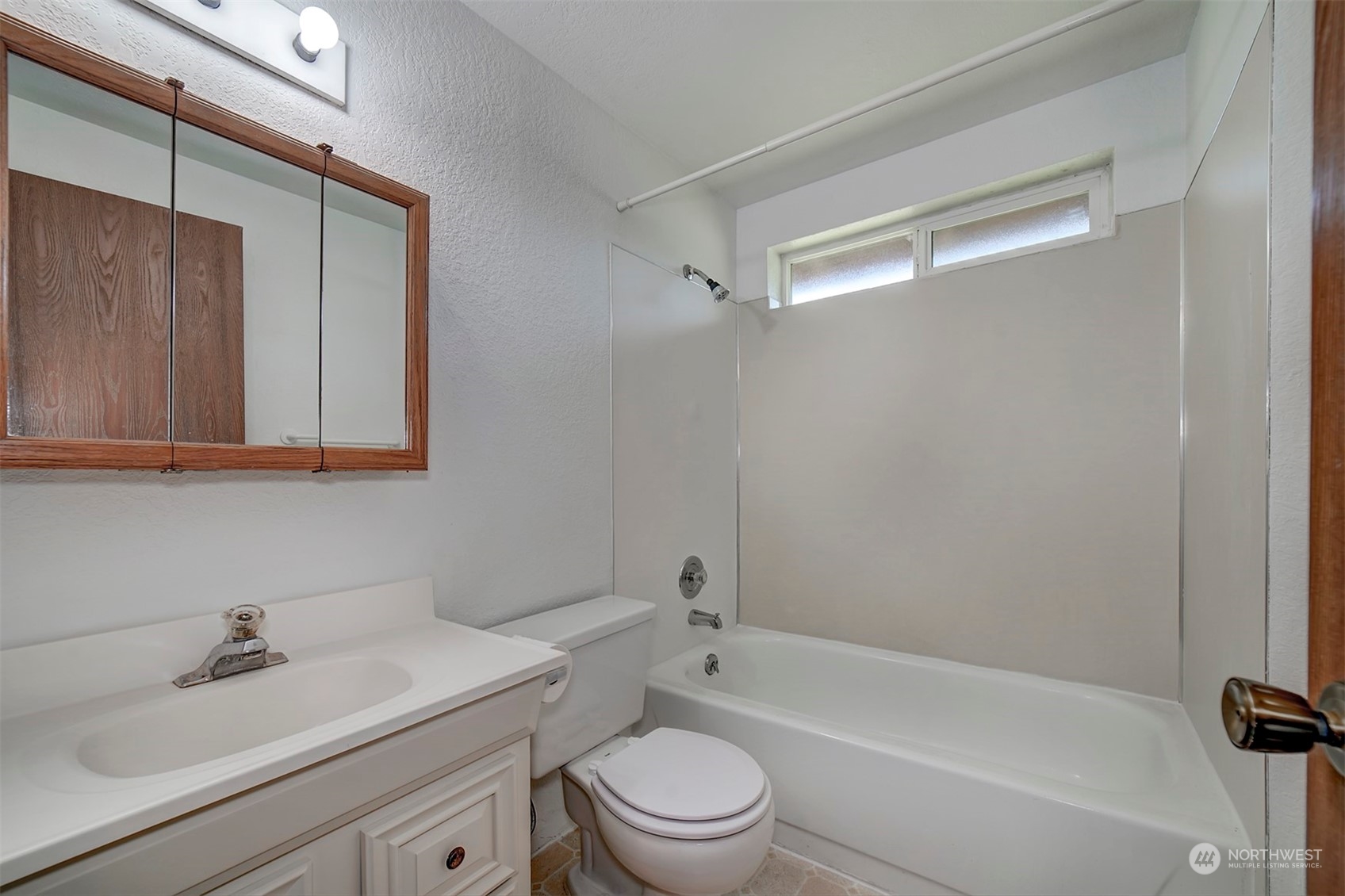 7615 Illahee Road Northeast Bremerton, WA 98311 - Photo 10 of 23 a bathroom with a sink a toilet and shower