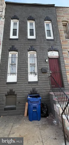 a view of a brick house with many windows