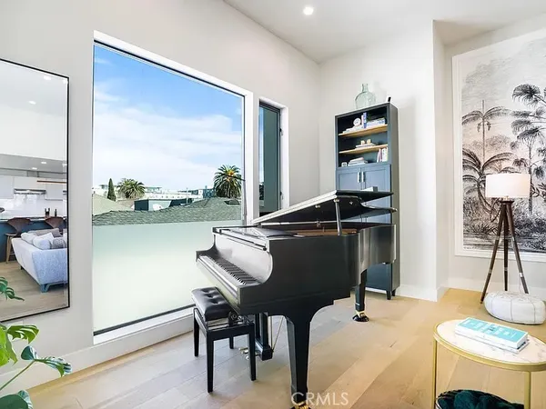 a room with furniture and a floor to ceiling window