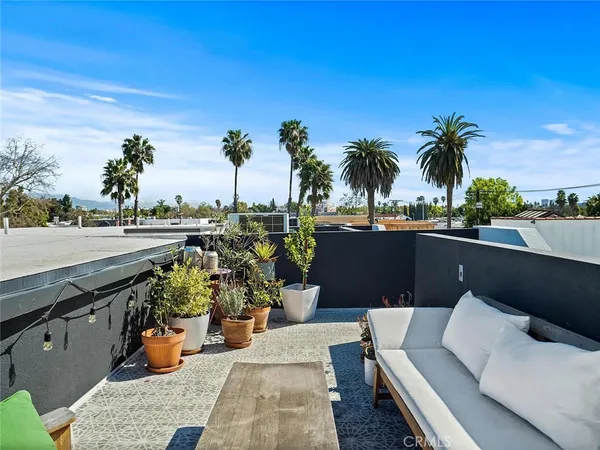 a view of a terrace with sitting area