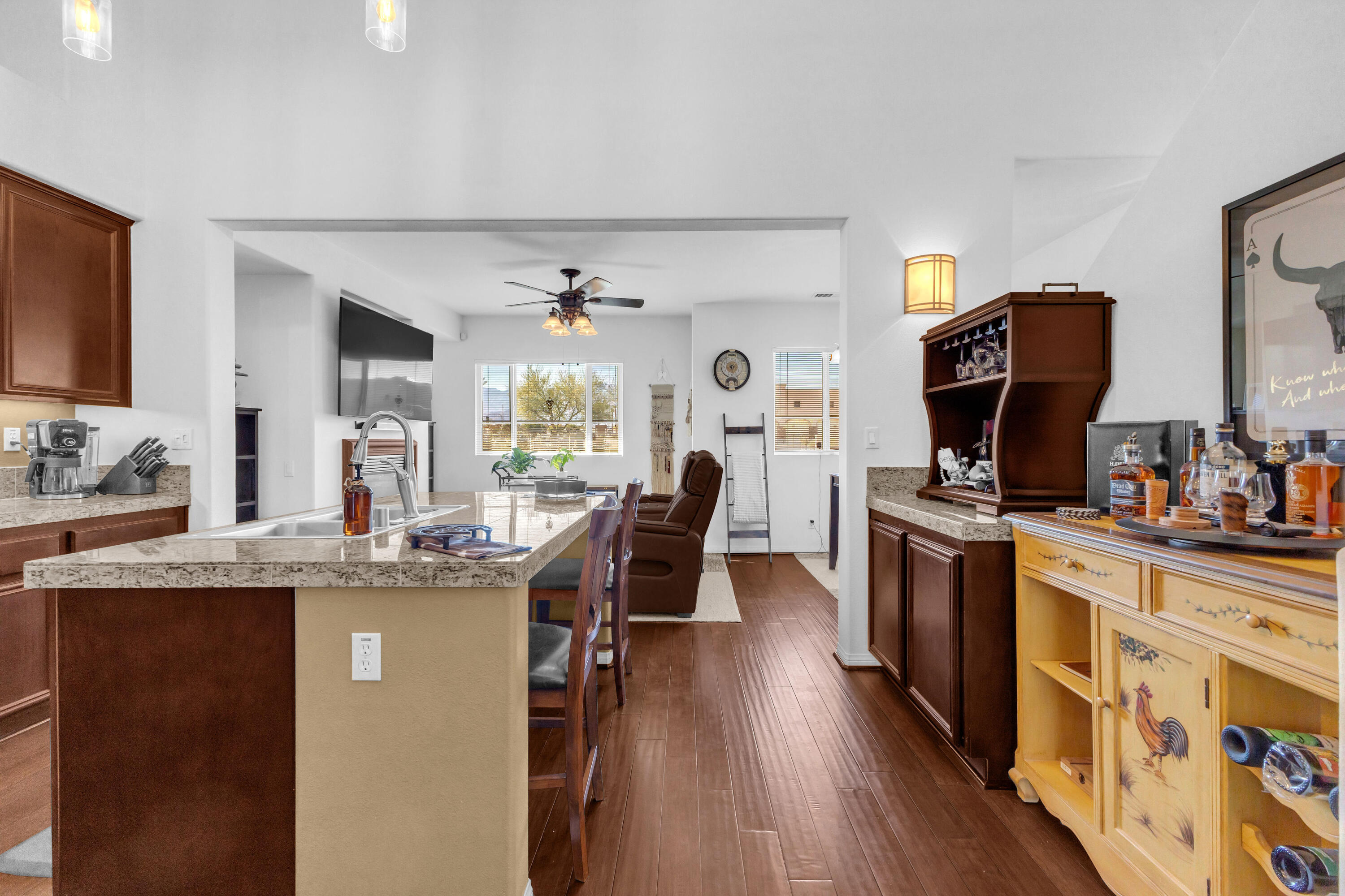 73268 Azure Rain, Unit 102 Palm Desert, CA 92211 - Photo 13 of 44 a kitchen with stainless steel appliances granite countertop a sink stove and wooden floor