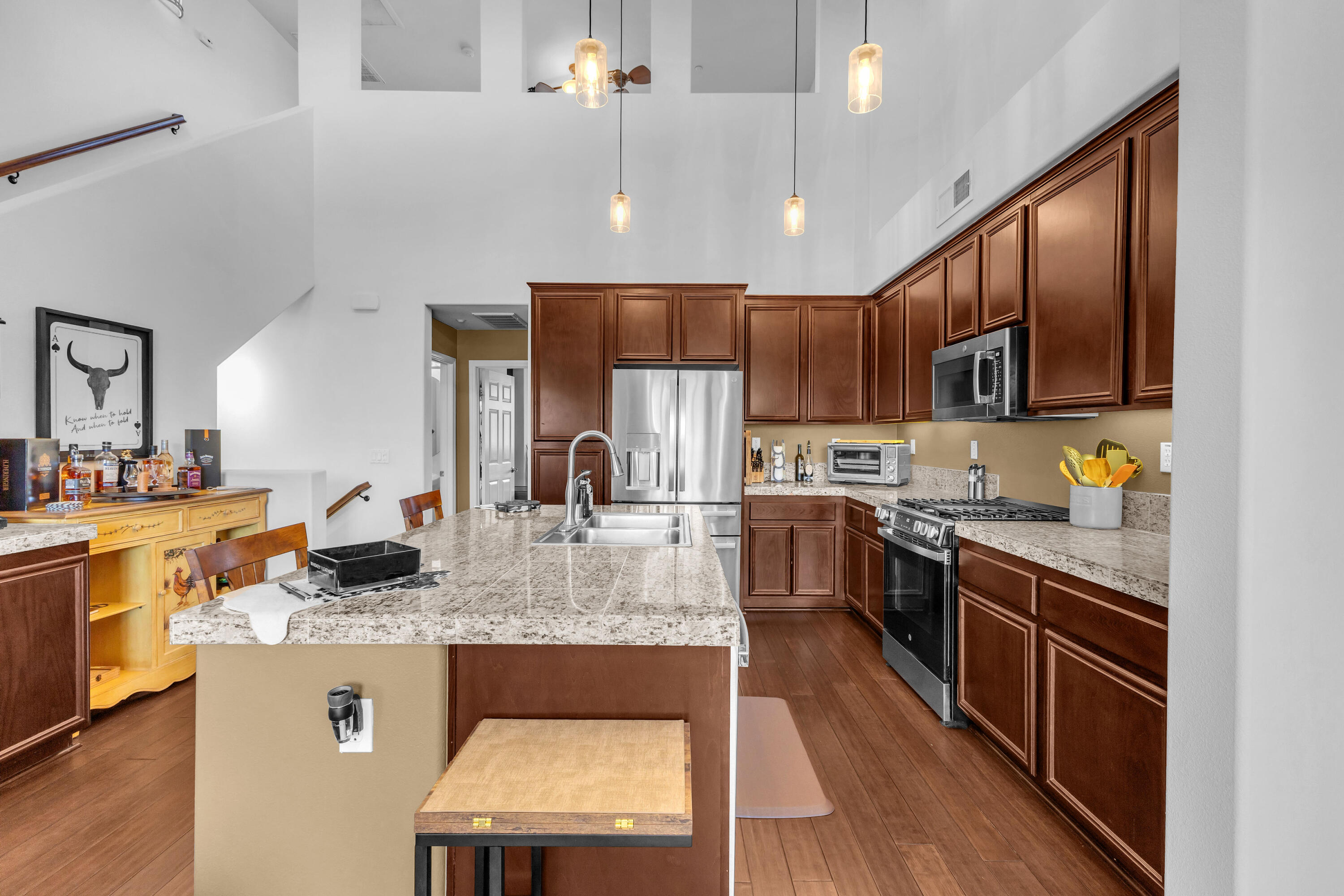 73268 Azure Rain, Unit 102 Palm Desert, CA 92211 - Photo 15 of 44 a kitchen with stainless steel appliances granite countertop a stove refrigerator sink and cabinets