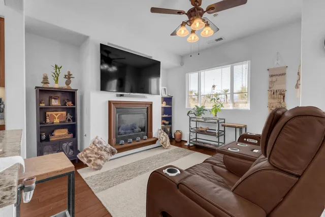 a living room with furniture and a fireplace